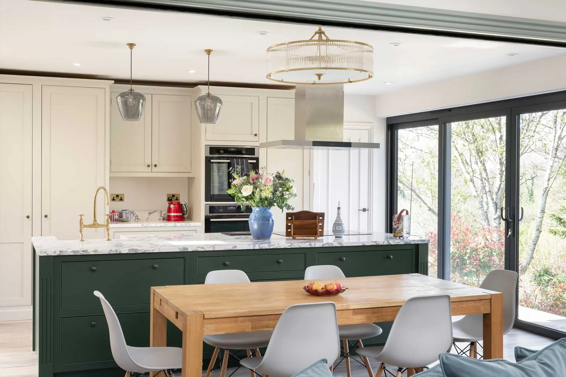Kitchen elevation showing seamless integration of high-end appliances within white cabinetry.