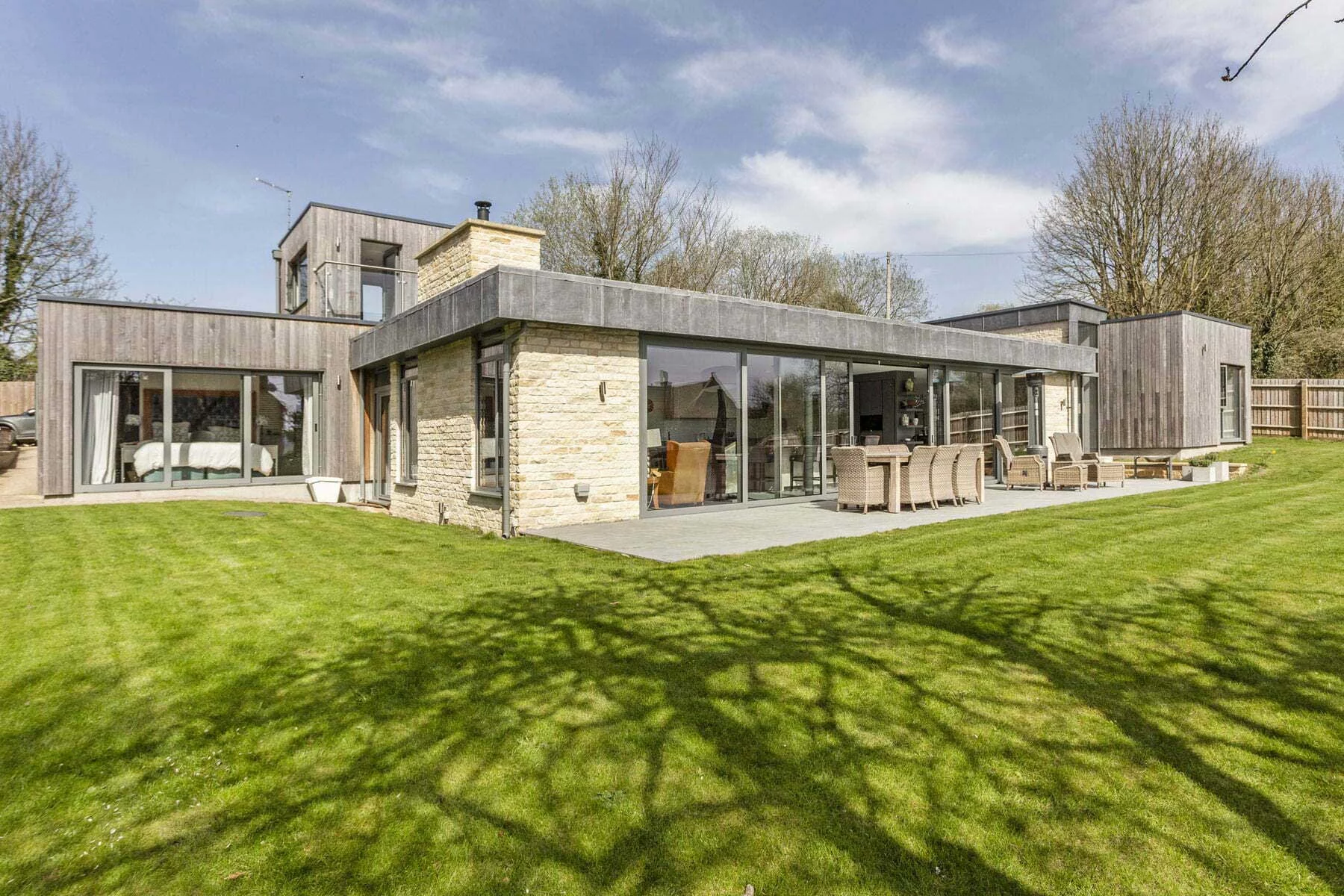Detailed view of the extensive lead-clad roof fascias and Bath stone masonry.